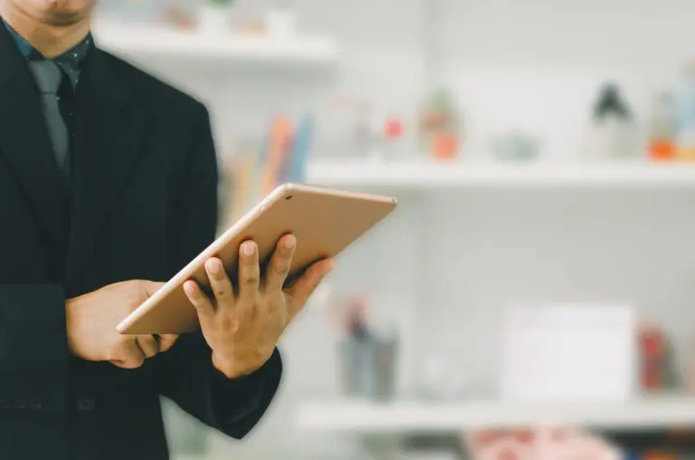 businessman holding a tablet to search for information and do business online.
