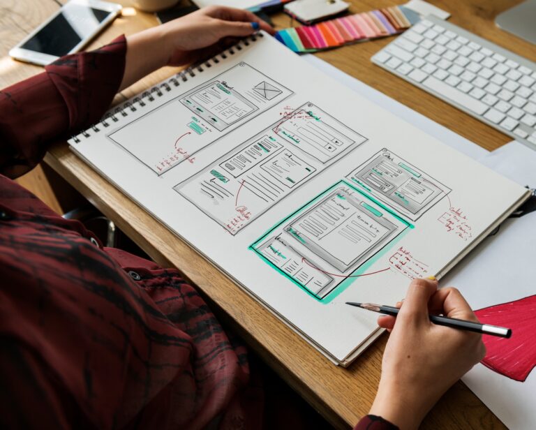 Fashion designer drawing, working in a studio